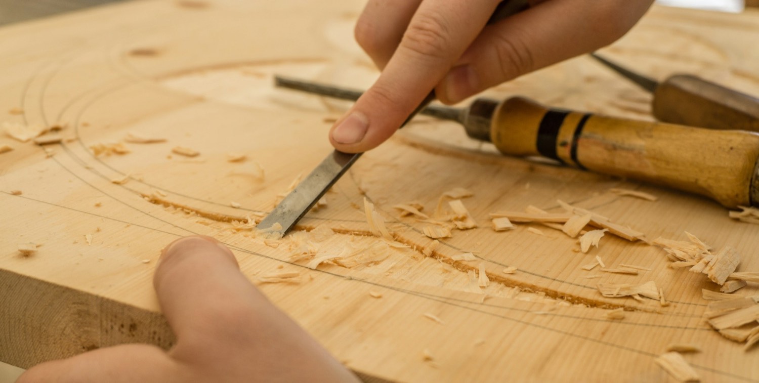 Working a piece of timber by hand at the bench